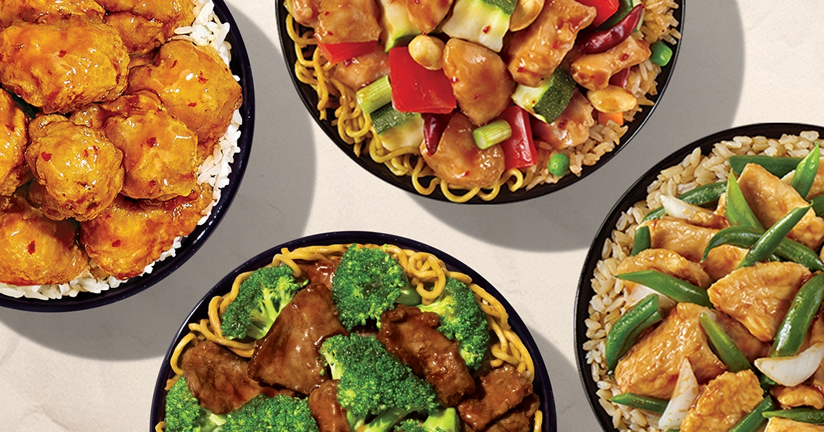 Four bowls of food are shown from above, each holding delicious dishes like broccoli beef, chicken with green beans, breaded chicken, and a veggie stir-fry—all looking fresh and flavorful with no excess oil, as if made straight from a clean grease trap.